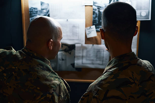 istock Collaborating During Tactical Military Planning Meeting 2205475461