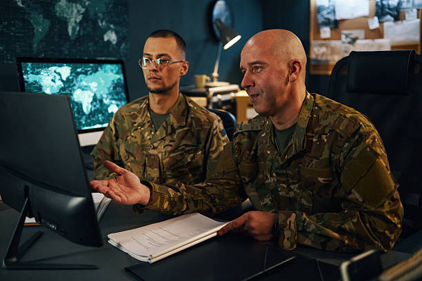 istock Discussing Military Strategy in Tactical Operations Room 2205475582