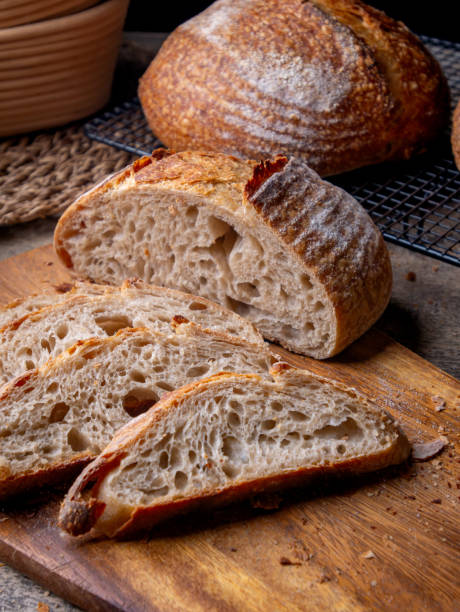 istock Sliced Artisan Sourdough Bread on Wooden Table. 2205476604