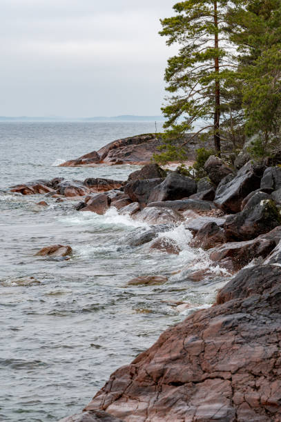 istock Small waves and white water on rocks in water 2205476640