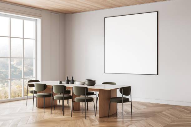 istock Minimalist dining room with large blank poster on white wall. 3D Rendering 2205478056