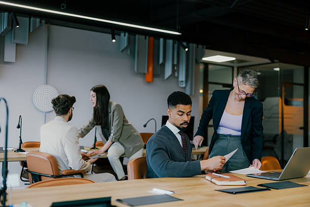 istock Group of multiracial entrepreneurs communicating during a meeting 2205478154