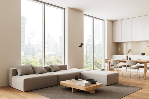 istock Modern living room with city view and open kitchen area. 3D Rendering 2205478189