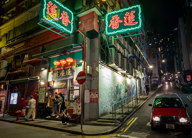 Hong Kong. China- 02.19.2025. Night exterior view of Lin Heung Lau, a famous traditional old style Cantonese Dim Sum tea house situated in Central.