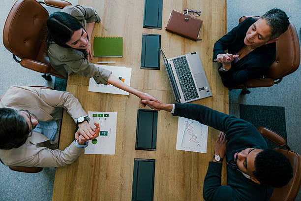 istock Top view of business team shaking hands 2205478269