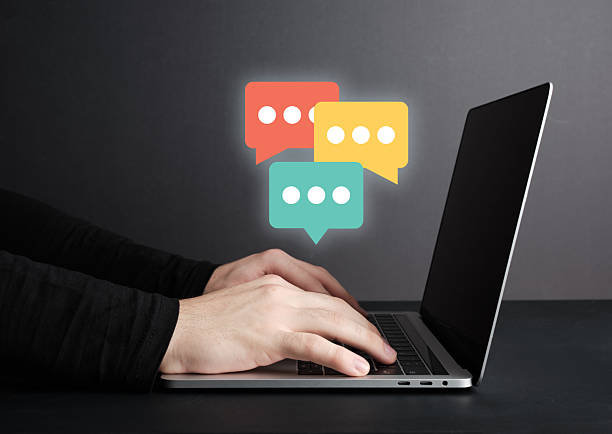 istock Male hands messaging or chatting on laptop computer, online communication concept. 2205479063