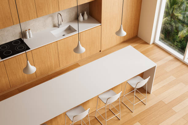 istock Modern kitchen interior with wooden cabinets and white countertops. 3D Rendering 2205479107