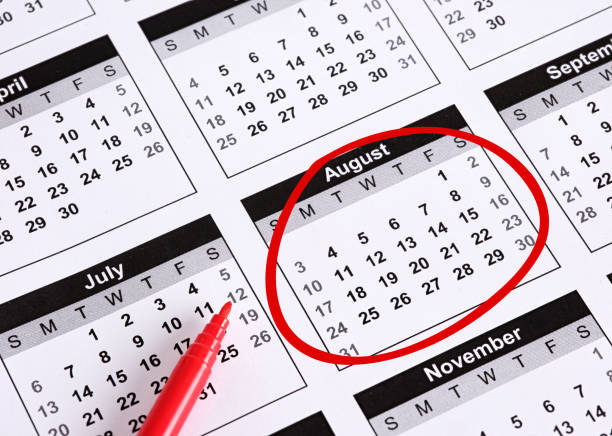 istock Red Marker Circling August on Calendar Page with Other Months Visible 2205479832