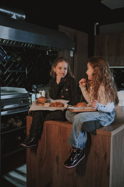 istock Sisters with smash burgers 2205479967