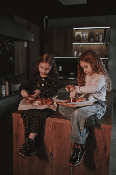 istock Sisters with smash burgers 2205479974
