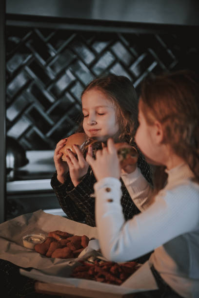 istock Sisters with smash burgers 2205479979