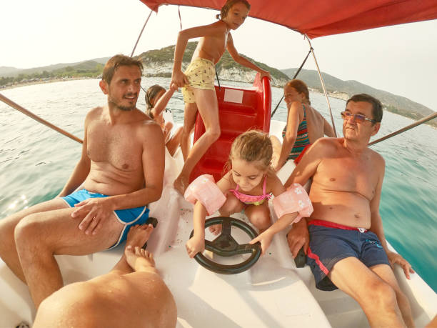istock Extended family on paddleboat 2205482173