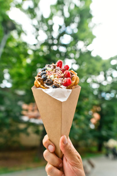 istock Hong Kong bubble waffle with ice cream, berries and chocolate outdoors in summer 2205483088