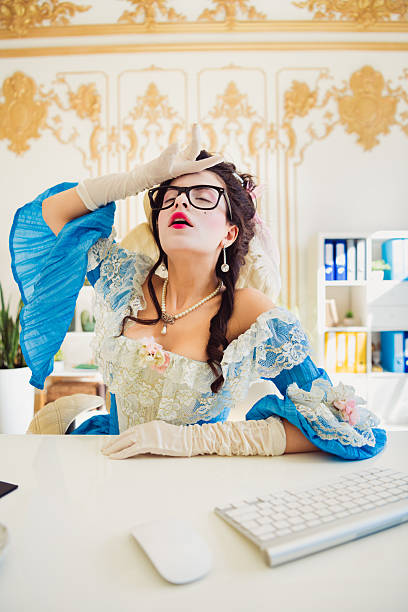 istock Modern Businesswoman Dressed as a Historical Queen in Elegant Office Setting 2205485105