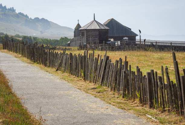 Mendocino County, California, USA - June 2, 2025: A visitor takes a photo of the historic Point Cabrillo Light Station at Point Cabrillo Light Station State Historic Park by the Pacific Ocean on the Northern California coast.
