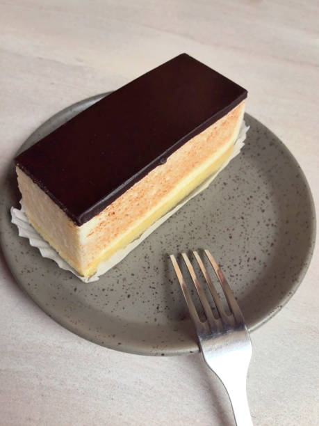 Delightful layered dessert on a ceramic plate in a cozy cafe setting