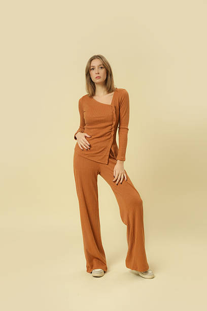 istock Studio photos of female model wearing basic comfortable knitted golden brown set, fall winter fashion collection. 2205487277