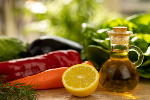 Cut lemon, red pepper. Fresh vegetables for salad in the kitchen. Proper nutrition. High quality photo