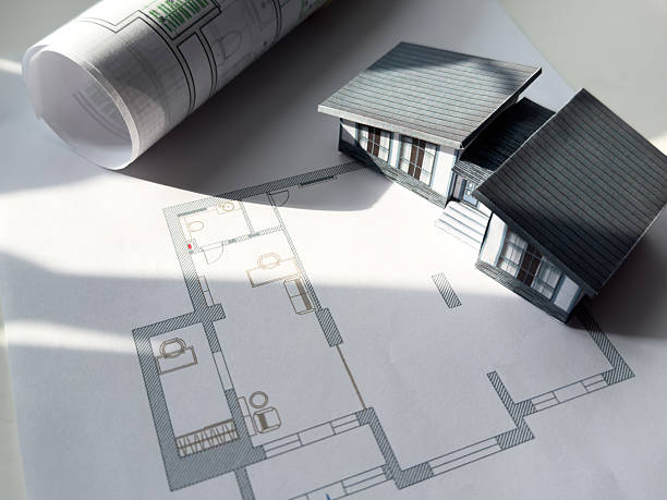 istock Building models and blueprints are placed on work desks in the construction engineering team offices to plan construction to achieve their goals and to simulate building models for clients to see. 2205489006