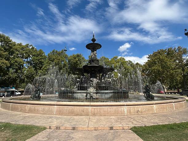 istock Majestic fountain in a park with clear blue sky. 2205489127