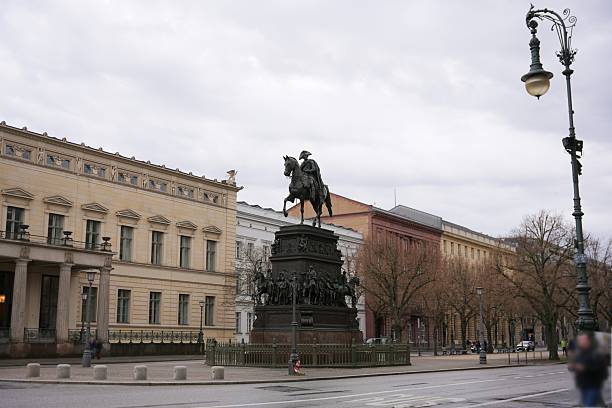 Berlin, Germany 02.13.2025 A majestic bronze equestrian statue of Frederick the Great, Prussian king, standing on an ornate pedestal in the heart of the city. Cloudy day