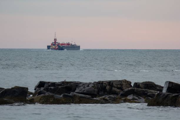 istock Distant view of a boat in the sea 2205493673