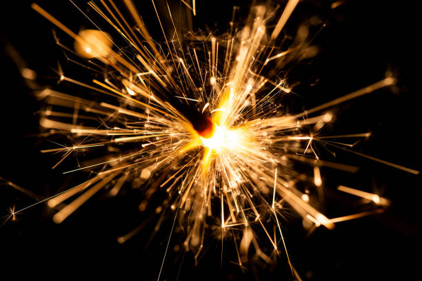 istock Glowing Sparkler Creating Bright Trails of Light in Dark Background Setting 2205494982