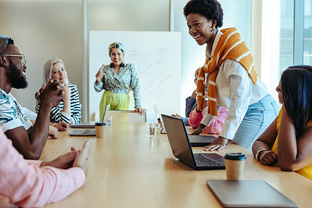 istock Cheerful colleagues engaging in a collaborative business meeting 2205499146