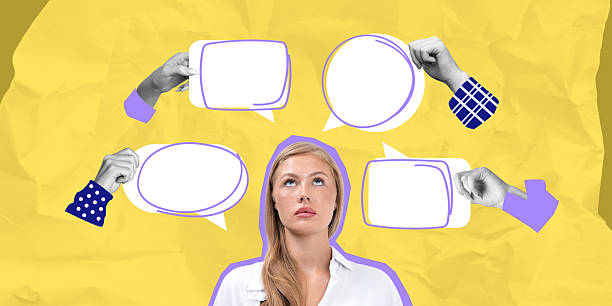 istock Woman surrounded by empty speech bubbles looking up in thought. 2205500403