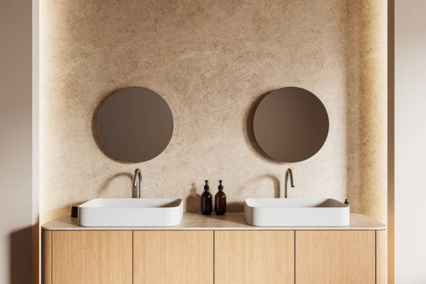 istock Modern bathroom interior with wooden vanity and round mirrors. 3D Rendering 2205500604