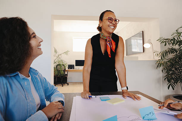 istock Professional team engaged in a friendly project management meeting 2205502866