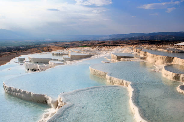 istock Pamukkale is a place where white texture, healing waters and history come together. Cloud, reflection, historical structures from the Hellenistic and Roman periods. healing spring water, health tourism 2205503942