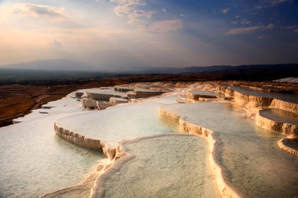 istock Pamukkale is a place where white texture, healing waters and history come together. Cloud, reflection, historical structures from the Hellenistic and Roman periods. healing spring water, health tourism 2205503970