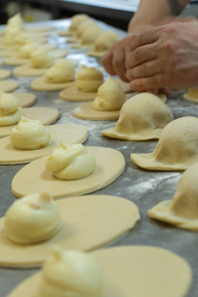 istock Preparation of Neapolitan sfogliatelle in the laboratory 2205504397