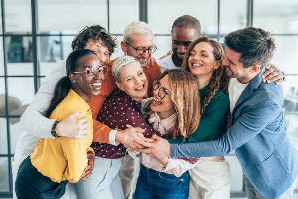 istock Cheerful team huddle in the office 2205505436