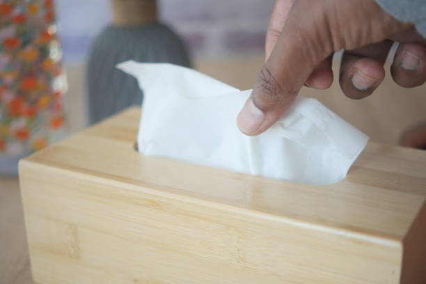 istock hand pull out a piece of tissue from tissue paper box 2205508027