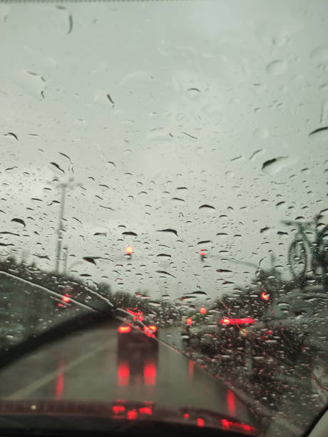 istock Raindrops blurring red brake lights during traffic standstill, capturing rainy urban mood in prague street scene 2205511112
