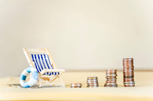 istock Beach Chair with Money 2205511160