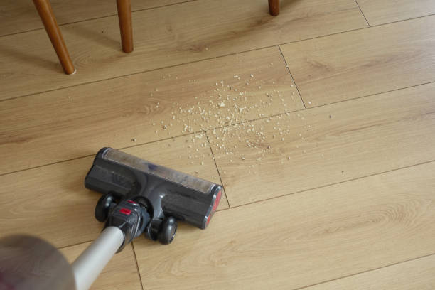 istock cleaning floor dust with vacuum cleaner. 2205513539
