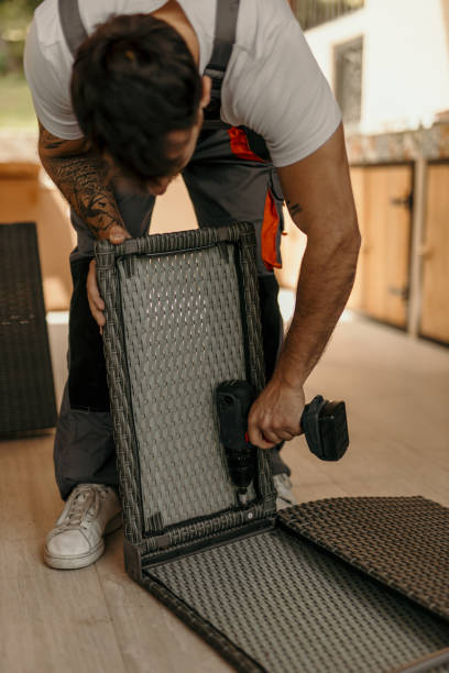 istock Handyman assembling furniture using cordless screwdriver 2205513571