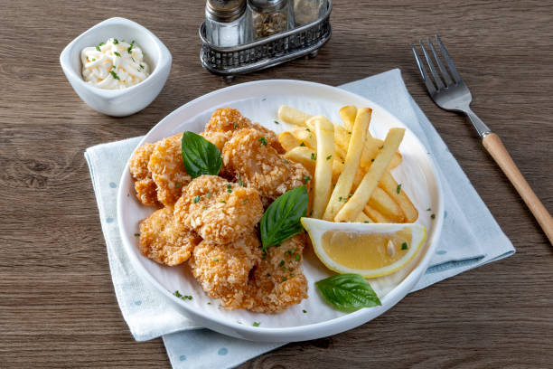 istock Chip Shop Food, deep fried food, battered food, fish and chips, black pudding, white pudding, burgers and chips, pies, chips, fish chips and peas 2205514208