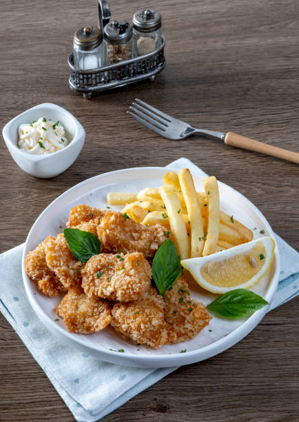 istock Chip Shop Food, deep fried food, battered food, fish and chips, black pudding, white pudding, burgers and chips, pies, chips, fish chips and peas 2205514217