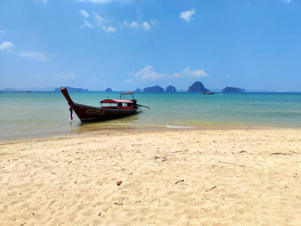 Long tail boat moored at Tub Kaek beach, a peaceful beach north of Ao Nang, Krabi province.