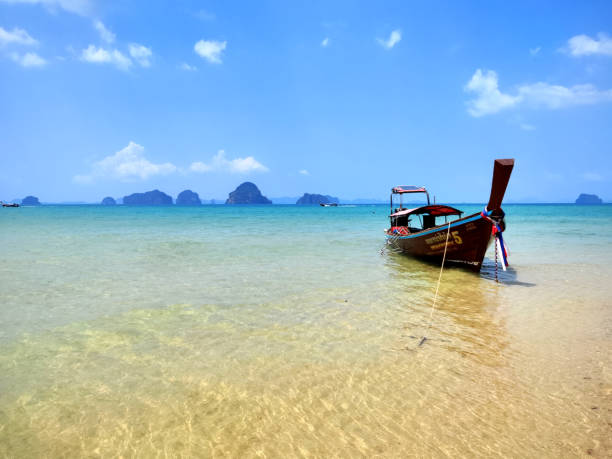 Long tail boat moored at Tub Kaek beach, a peaceful beach north of Ao Nang, Krabi province.