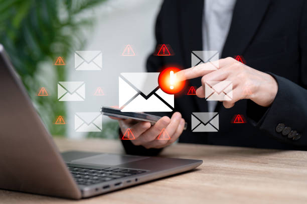istock Cybercrime security concepts, Scam warning messages and traps, Fraud warning messages, Businesswomen beware of clicking on fraudulent links messages on smartphone, Threats, phishing, malicious, hack 2205516411