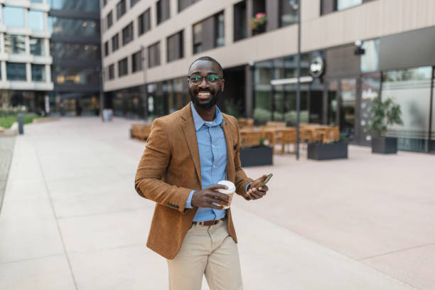 istock Man smiling and preparing to greet with coffee 2205517778
