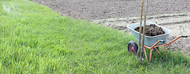 istock application of fertilizers to improve soil 2205518174