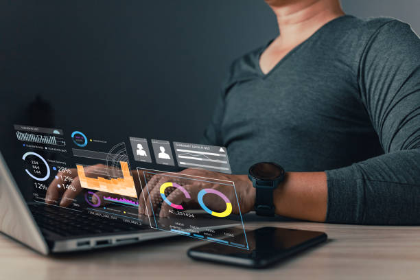 istock A person uses a laptop with digital data overlays, showcasing technology and analytics in a modern workspace. 2205518746