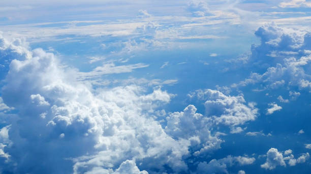 istock Blue sky fluffy white clouds on summer season bright clear skyline with beautiful cloudscape. Panorama blue sky clouds pattern on daylight with copy space. Cumulus cloudscape air climate sunny day 2205524631