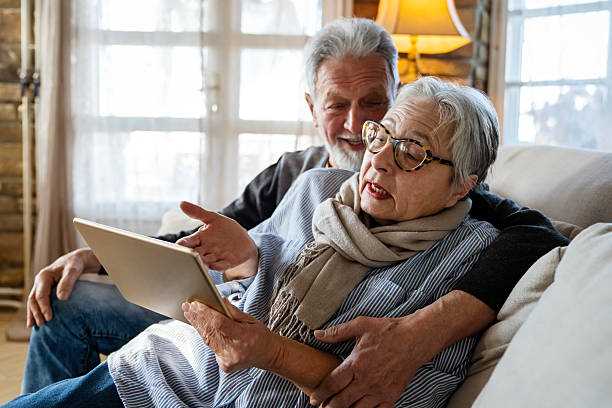 istock Annoyed mature woman having problem with computer tablet, irritated by bad news, electronic device 2205524813